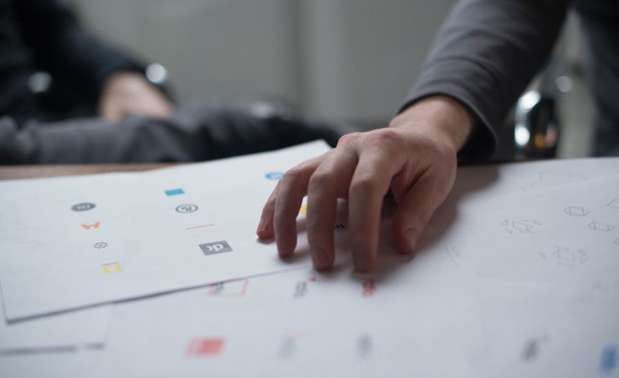 Designer reviewing logo design options