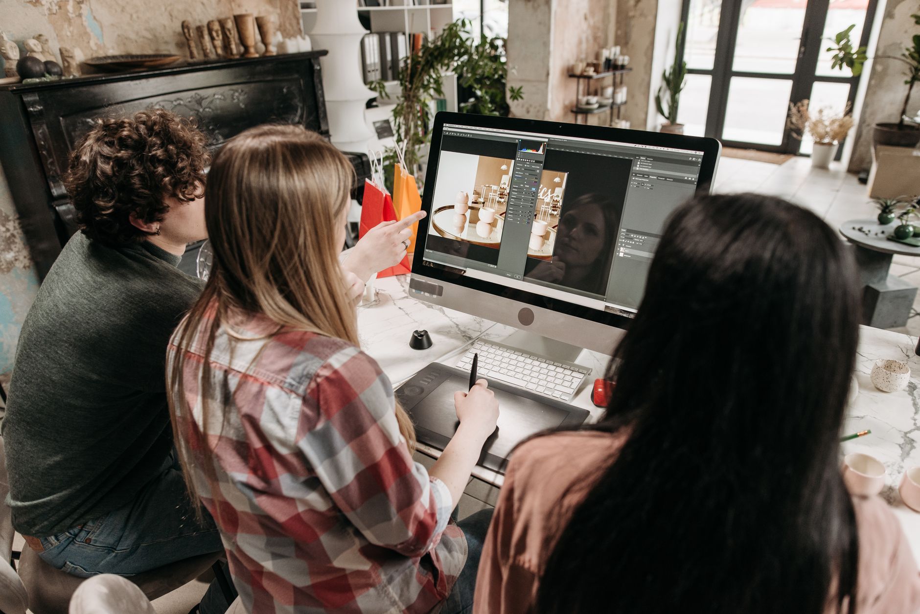 Creative team working on design at a computer