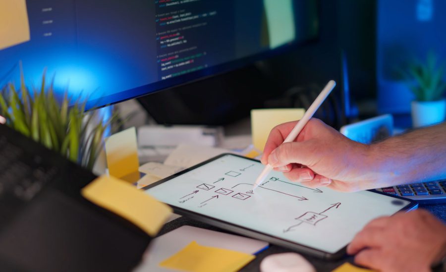 UX designer sketching wireframes on a tablet
