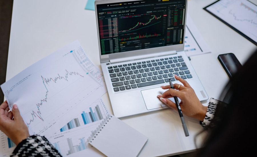 Reviewing financial charts on a laptop