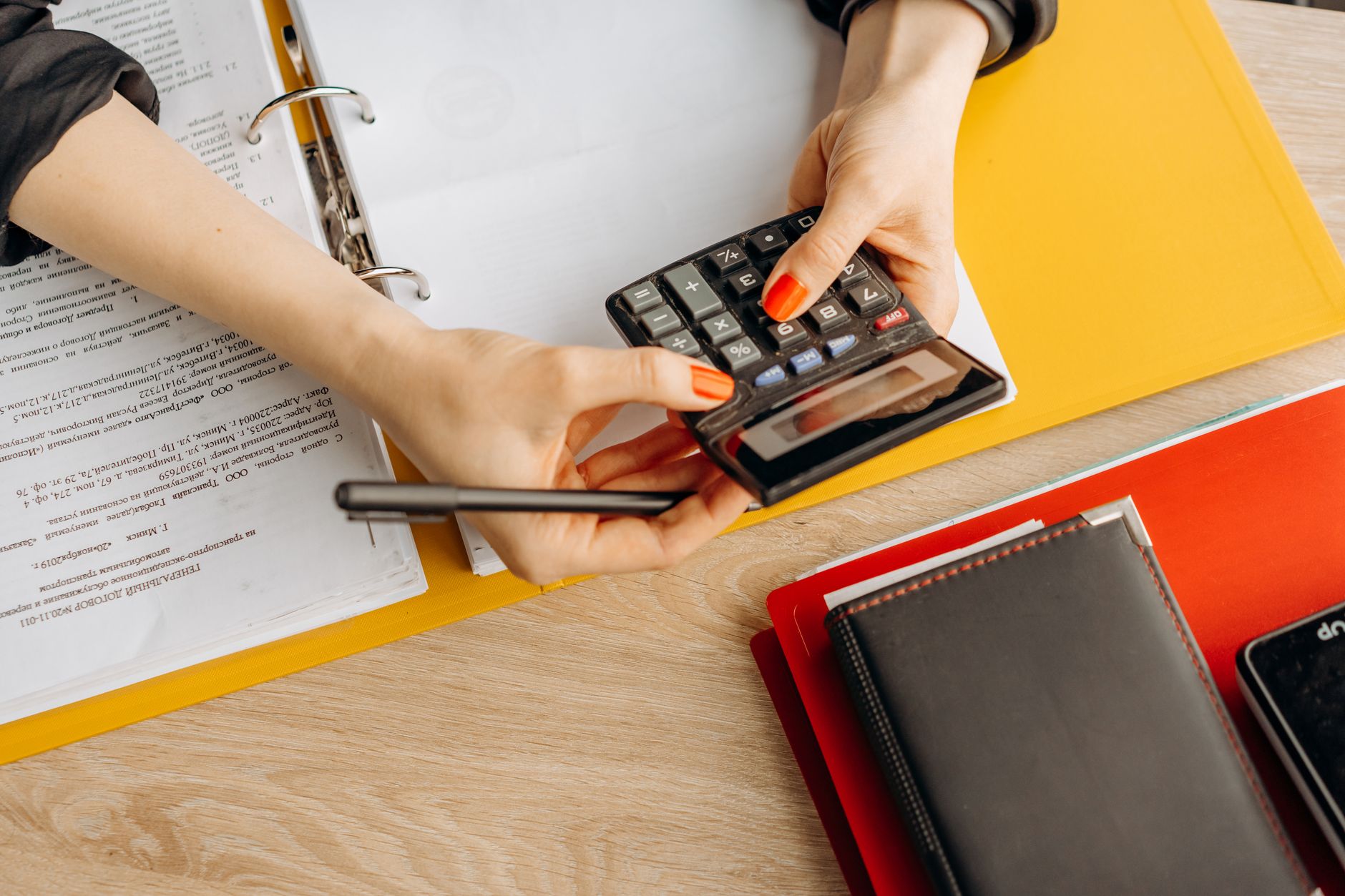 Using a calculator with accounting documents